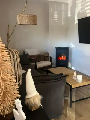 a living room with a couch and a fire place at El refugio del mar in Playa de Mar