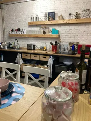 a kitchen with a table with a bottle of wine at La Auténtica in Valencia