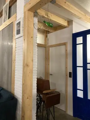 a room with a table and a blue door at La Auténtica in Valencia