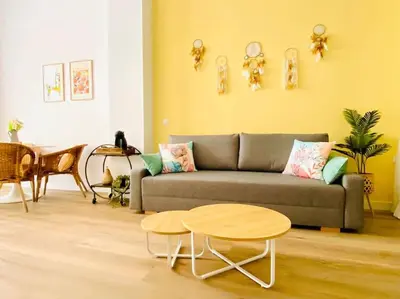 a living room with a couch and a table at Beautiful and Charming Loft in Russafa SOHO in Valencia