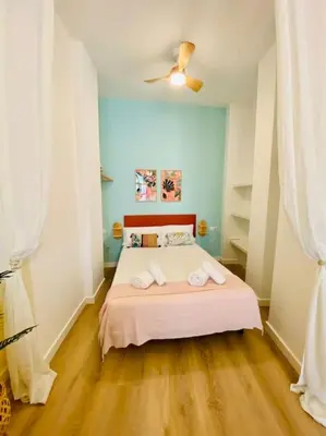 a bedroom with a bed with two towels on it at Beautiful and Charming Loft in Russafa SOHO in Valencia