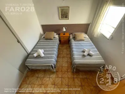 a room with two beds in a room at Faro28 in Valencia