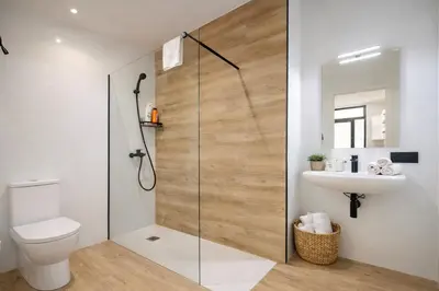 a bathroom with a shower with a toilet and a sink at Avakian Valencia Centro in Valencia