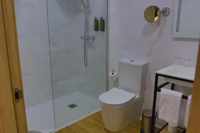 a bathroom with a shower and a toilet and a sink at SH Campus Lyceum in Moncada