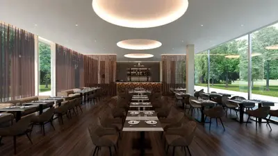 a restaurant with tables and chairs and large windows at SH Campus Lyceum in Moncada