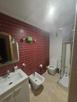 a bathroom with a white sink and a toilet at Las Jarcias 2C in Moncófar