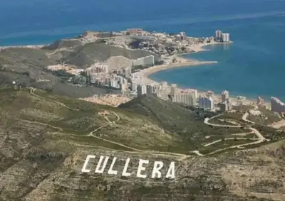 an aerial view of a city on a hill at Cerca del mar, ascensor, descuentos semanales 4 personas in Cullera