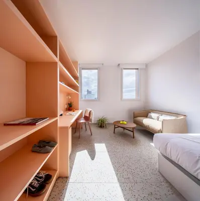 a white bedroom with a bed and a couch at Valencia Tower in Burjasot