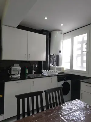 a living room with a glass table and a dining room at Sea view apartment in Cullera