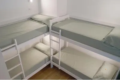 two empty bunk beds in a room at Aiora Hostel in Valencia