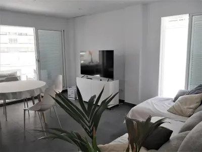 a living room with a bed and a table at Bellaterra, BQ-2, BAJO A in Cullera
