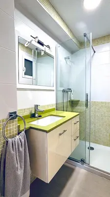 a bathroom with a sink and a shower at Apartamento primera línea playa San Antonio in Cullera