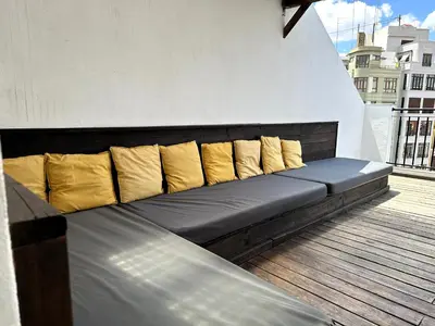a bedroom with two beds and a mirror at Mercado Central Suites in Valencia