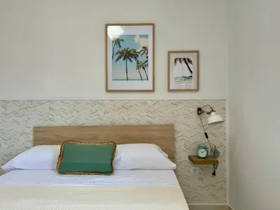a bedroom with a bed and two pictures on the wall at Vistas al Castell de Alacuas in Alaquas