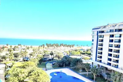 an aerial view of a resort with a swimming pool and the ocean at BEACH VALENCIA LUXURY D15-9 Apartment with terrace and sea views with two rooms in Valencia