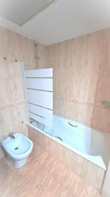 a bathroom with a sink and a tub and a toilet at BEACH VALENCIA LUXURY D15-9 Apartment with terrace and sea views with two rooms in Valencia