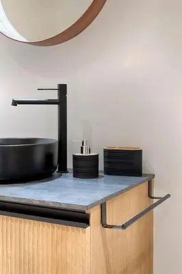a kitchen counter with a black sink and a mirror at Ruzafa´s Gate 3 in Valencia
