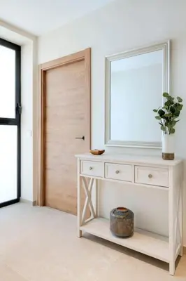 a white dresser with a mirror on top of it at Portal de Ruzafa 4 in Valencia