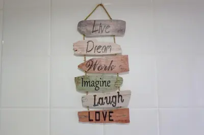 a christmas tree made out of wood with the words life dream merry imagine laugh at Lovely apartment near the beach & City of Arts and Sciences in Valencia