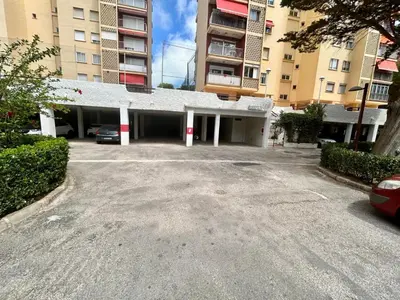 an empty parking lot in front of a building at District Key - Saler, Av Gola Puchol 14 in Valencia