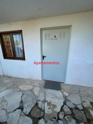 a white garage door with a sign on it at Beauty Garden in Cullera