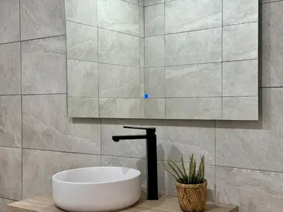 a bathroom with a white tub and a sink at Cabanyal Apto luminoso y playa in Valencia