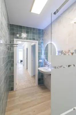 a bathroom with a shower and a sink at Cabañal Retreat in Valencia
