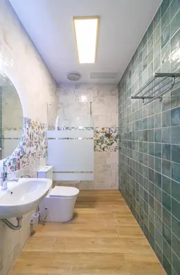 a bathroom with a sink and a toilet at Cabañal Retreat in Valencia
