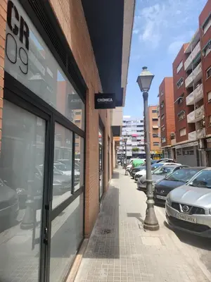 a street with cars parked outside of a building at Dormavalencia Crónica in Valencia