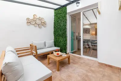 a living room with a couch and a table at Travel Habitat Bioparc Apartments in Valencia