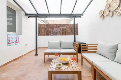 a living room with two couches and a table at Travel Habitat Bioparc Apartments in Valencia
