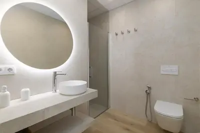 a bathroom with a sink and a mirror at ApartUP Ca La Leni Beach V in Valencia