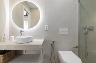 a bathroom with a sink and a mirror at ApartUP Ca La Leni Beach IV in Valencia