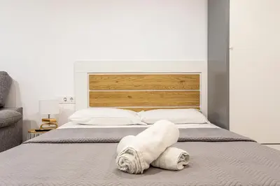 a bedroom with a bed with a towel on it at New Loft Ruzafa market, wifi AC in Valencia