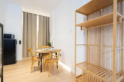 a dining room with a table and chairs at The Blasco Ibañez Apartments in Valencia