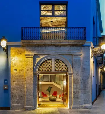 a building with a balcony on top of it at Axel Hotel Valencia - Adults Only in Valencia
