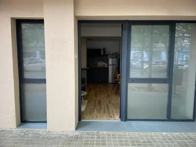 an entrance to a building with sliding glass doors at Junto al Jardín del Turia Apartamento in Valencia