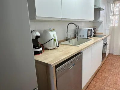 a kitchen with a sink and a counter top at Euromar Playa Cullera frente al mar con garaje in Cullera