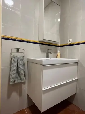a white bathroom with a sink and a mirror at Valencia nuevo centro in Valencia