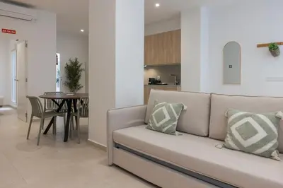 a living room with a couch and a table at VLC HOST - Alfaro A in Valencia