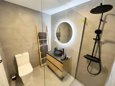 a bathroom with a sink and a mirror at Apartamento Ático en Valencia in Valencia