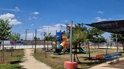 a playground with a slide in a park at Ca les Rinconetes in Riola