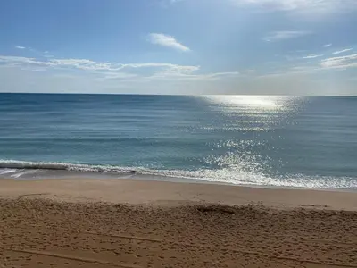 a view of the ocean from a sandy beach at Caballito de Mar in Tavernes de Valldigna