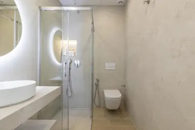 a bathroom with a shower and a toilet and a sink at ApartUP Ca La Leni Beach III in Valencia