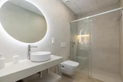 a bathroom with a sink and a shower at ApartUP Ca La Leni Beach II in Valencia