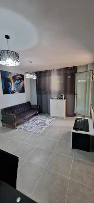 a living room with a couch and a table at Apartamento playa Moncofa-Chilches in Chilches