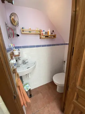 a bathroom with a sink and a toilet at Casa Rural El Molino in Macastre
