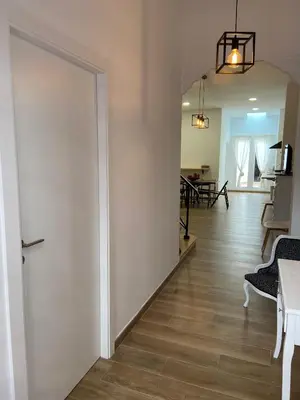 a hallway with a door and a dining room at Casa La Culle in Favareta