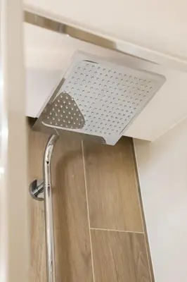 a shower door with a shower head in a bathroom at Apartamento Palermo Living Suites en Burriana in Burriana