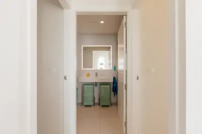 a bathroom with a sink and a mirror at Terrasses - Beach apartment with swimming pool in Puzol